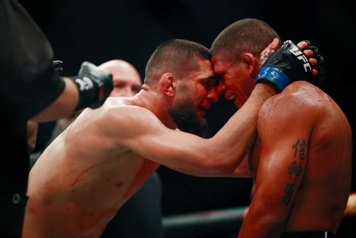 Khamzat Chimaev (l.) congratulates Gilbert Burns on a valiant effort during UFC 273.
